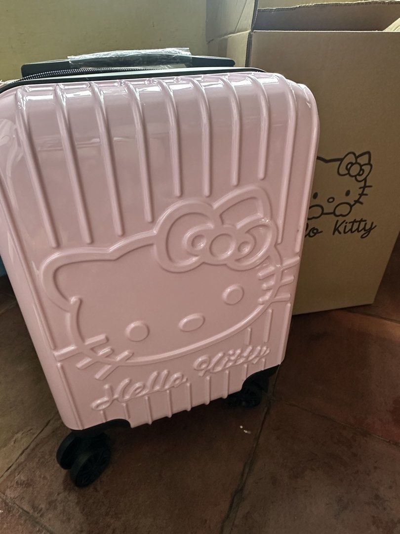 Pink Sanrio Hello Kitty Hard Case Luggage (Category: Luggage) located in Quezon City. Submitted by sabab.png (Listing ID 1458559064, Image 1). Description: -Hello kitty embossed hard case hand carry luggage - built-in combination lock for security - 360 wheels - approx (16in x 14in x 8in) (lwh) DM for more details.