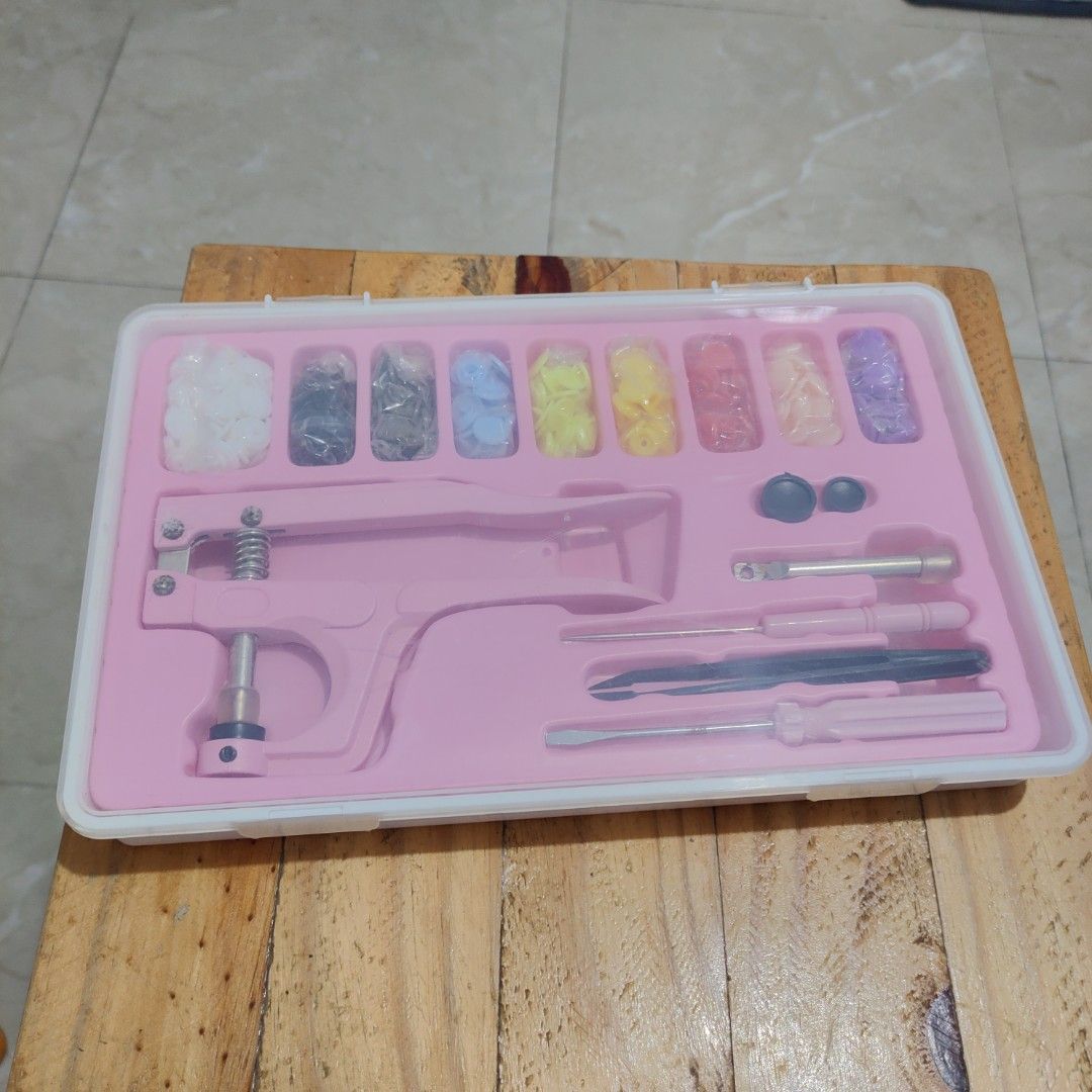 Pink Snap Button Pliers Kit with Assorted Snaps and Tools (Category: Craft Supplies & Tools) located in Manila. Submitted by purecloud_e63fae (Listing ID 1458594360, Image 1). Description: Bought for ₱480, selling for only ₱300. - Complete set with tools - Assorted snap buttons - With storage box - Good for DIY/crochet/sewing projects Condition: Brand new / unused RFS: Nadoble ang bili.
