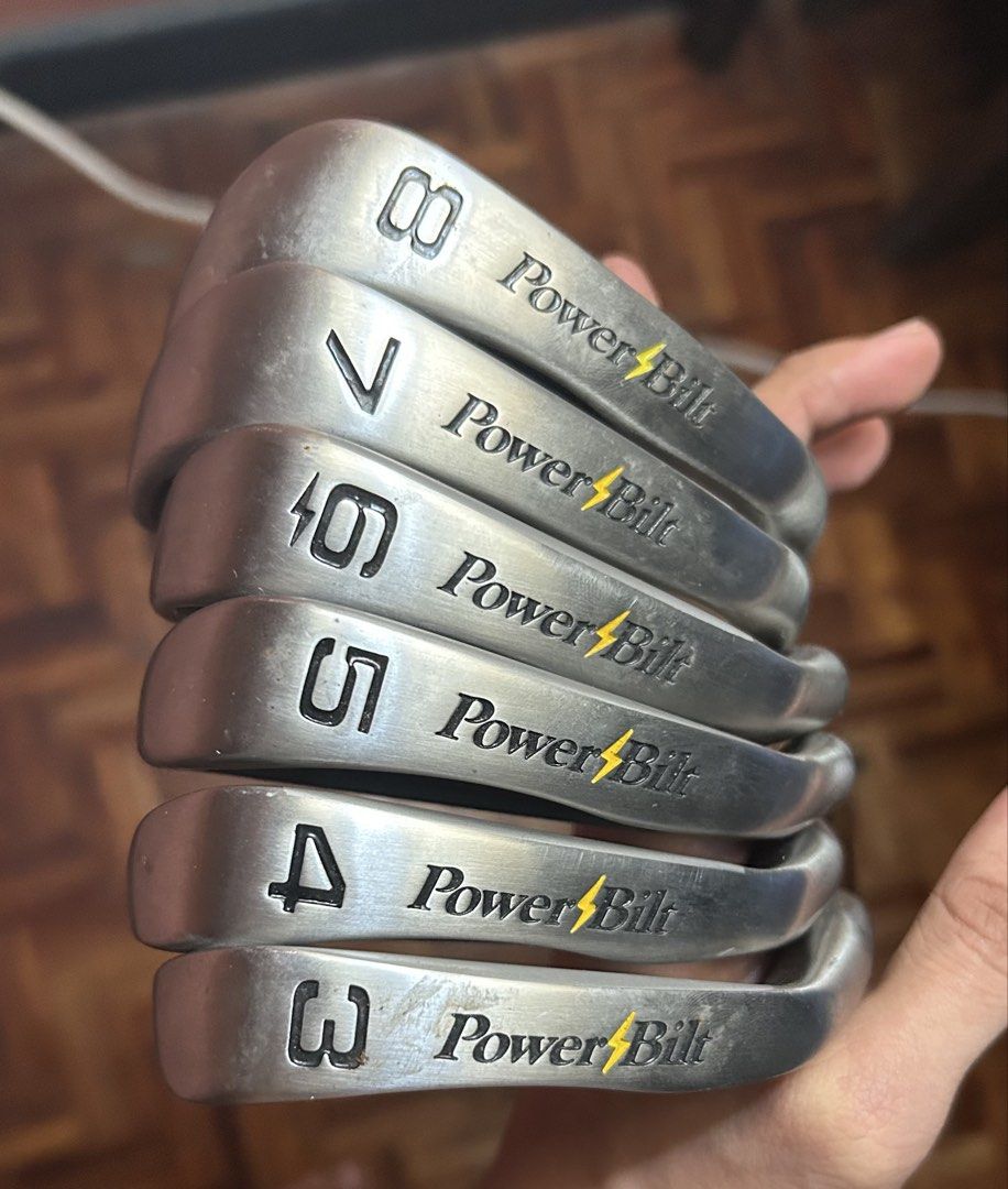 PowerBilt TPS Oversize Graphite Iron Set Golf Clubs (Category: Golf) located in Caloocan City. Submitted by dillydadi67 (Listing ID 1458632231, Image 2). Description: - Set includes PowerBilt TPS Oversize irons: 3-iron through 8-iron. - Features regular flex graphite shafts for optimal swing speed. - Equipped with original PowerBilt branded grips. - Negotiable.