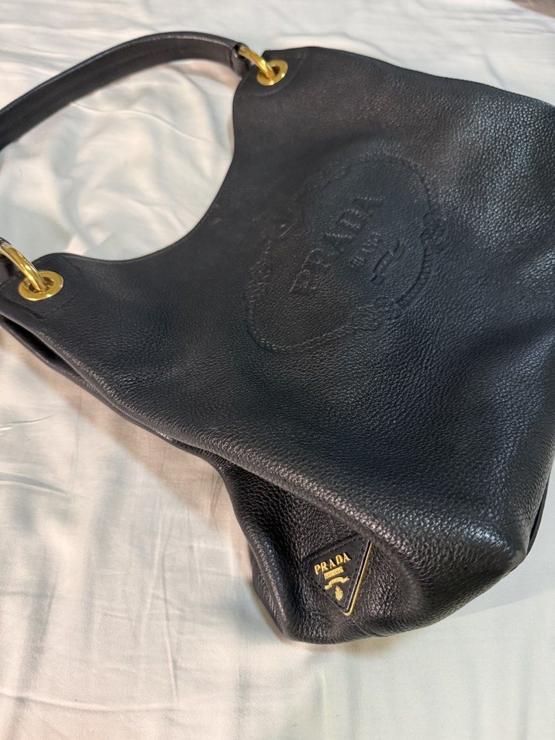 Prada Vitello Phenix Hobo Bag Black Leather (Category: Luxury Bags & Wallets) located in Quezon City. Submitted by happymommy01 (Listing ID 1458563966, Image 2). Description: - Authentic Prada Hobo Bag - Color: Black - Material: Vitello Phenix Leather - Model: 1BC051 - Purchase Year: 2019 - Includes: Authenticity Cards, Dust Bag.