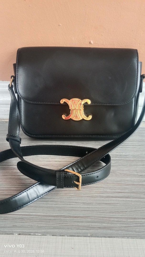 Preloved Celine Triomphe Bag Black Leather Gold Hardware (Category: Luxury Bags & Wallets) located in Cabuyao City. Submitted by selections888 (Listing ID 1458537967, Image 1). Description: - preloved Black Leather Celine Bag - Iconic Gold Triomphe Clasp - Adjustable Shoulder Strap - Classic & Versatile Design (Day to Night) - Minimal Signs of Wear - Clean Interior - Celine engraved on hardwares -small size -with made and code -elegant and eye ca