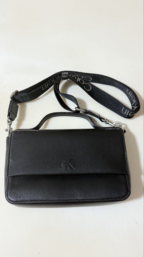 Preloved original CK small top handle/sling bag (Category: Cross-body Bags) located in San Pedro. Submitted by rfvpm (Listing ID 1458554882, Image 1). Description: Oroginal Preloved small top handle/sling bag CK bag. No flaws. Used once. Removable sling. P2500 free shipping via jnt..