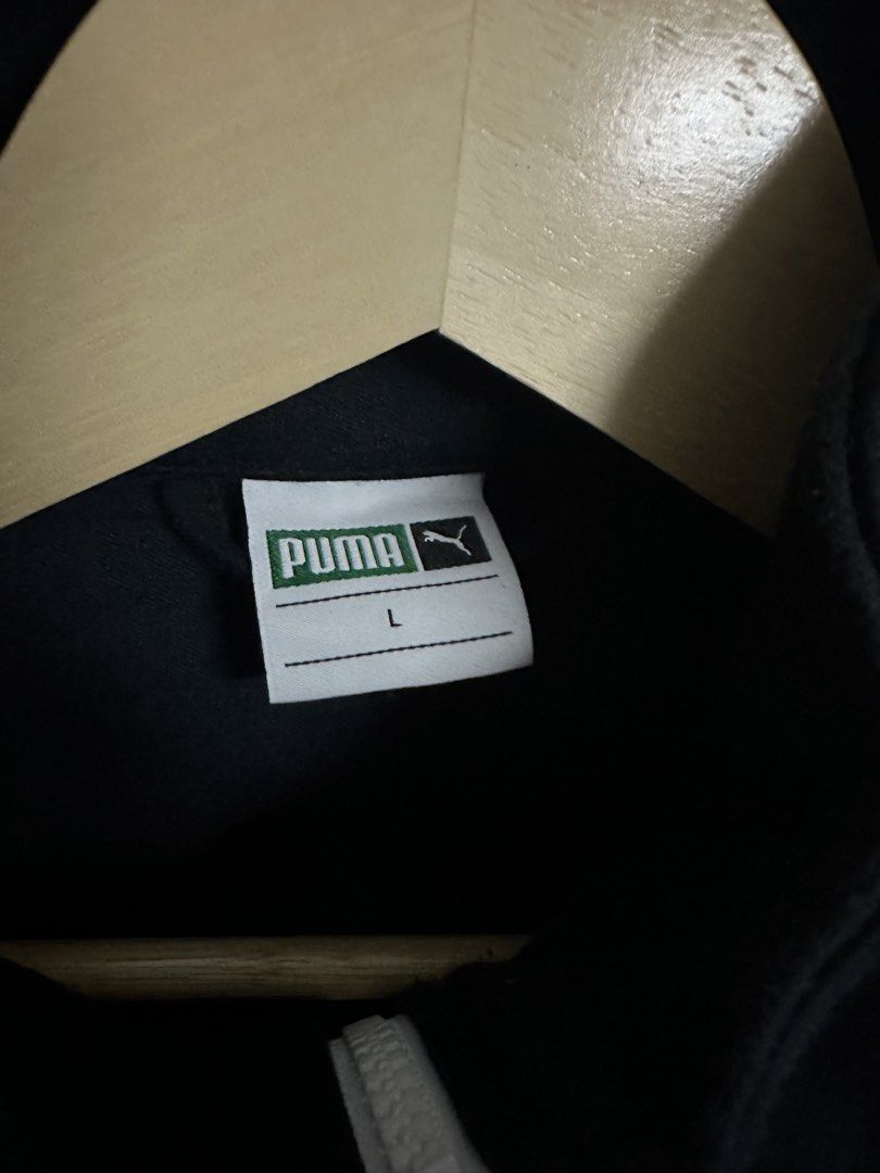 Puma T7 Track '68 Jacket Black White Size L (Category: Coats, Jackets and Outerwear) located in Mandaluyong City. Submitted by nielc02 (Listing ID 1458673587, Image 3). Description: - Classic Puma T7 track jacket - Color: Black with white sleeve stripes - Features: Full zip closure, pockets - Iconic Puma logo detail - Size: Large (L) Dimes: W22 x L29 - Faithful replication of the original T7 design.