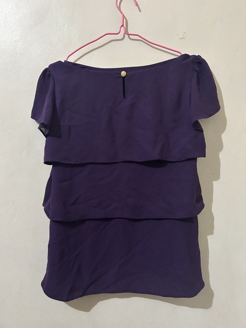 Purple Ruffle Layered Top (Category: Blouses) located in Naga. Submitted by aroaldaw (Listing ID 1458519779, Image 2). Description: - Chic purple top with elegant layered ruffles. - Comfortable short sleeves and a sophisticated boat neckline. - Convenient button closure at the back with a stylish keyhole detail. - Lightweight and flowy fabric for a graceful drape. - Versatile piece: dress it up for a night out or down for a casual day..