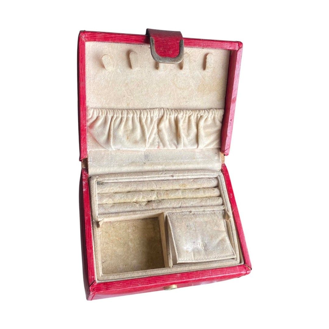 Red Jewelry Box Organizer (Category: Accessory Holder, Box & Organizers) located in Manila. Submitted by singlejourneyticket (Listing ID 1458576375, Image 3). Description: - Red textured jewelry box - Features compartments for rings and small items - Lid includes slots for earrings - Shows some signs of wear (inside and out).
