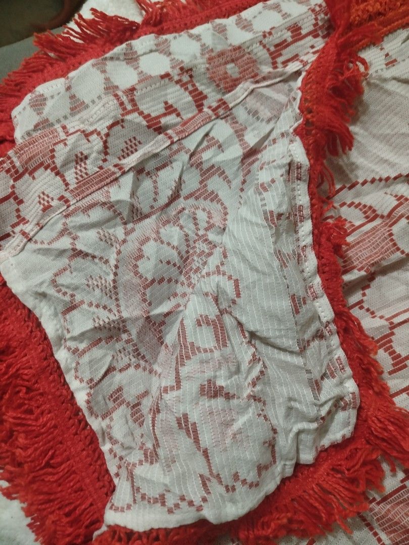 Red Ornage and White Patterned Tablecloth with Fringe (Category: Table Linen & Textiles) located in Imus. Submitted by stop_shop7 (Listing ID 1458572336, Image 2). Description: - Eye-catching red and white geometric and floral pattern. - Elegant fringe trim along all edges. - Textured weave fabric for a premium feel. - Perfect for livening up your dining table or as a decorative accent. - Versatile use as a tablecloth or throw. -size 68*98in..