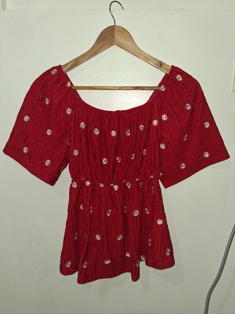 Red Textured Crop Top with Daisy Embroidery (Category: Sleeveless) located in Manila. Submitted by kxkcx (Listing ID 1458593684, Image 2). Description: - Adorable red crop top - Textured fabric with embroidered white daisies - Flattering off-shoulder design - Cute short flutter sleeves - Versatile: pairs well with jeans or shorts - Fun and flirty style.