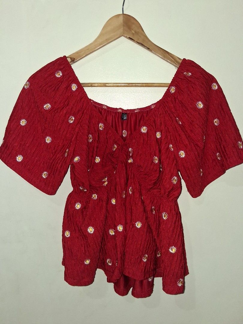 Red Textured Crop Top with Daisy Embroidery (Category: Sleeveless) located in Manila. Submitted by kxkcx (Listing ID 1458593684, Image 1). Description: - Adorable red crop top - Textured fabric with embroidered white daisies - Flattering off-shoulder design - Cute short flutter sleeves - Versatile: pairs well with jeans or shorts - Fun and flirty style.