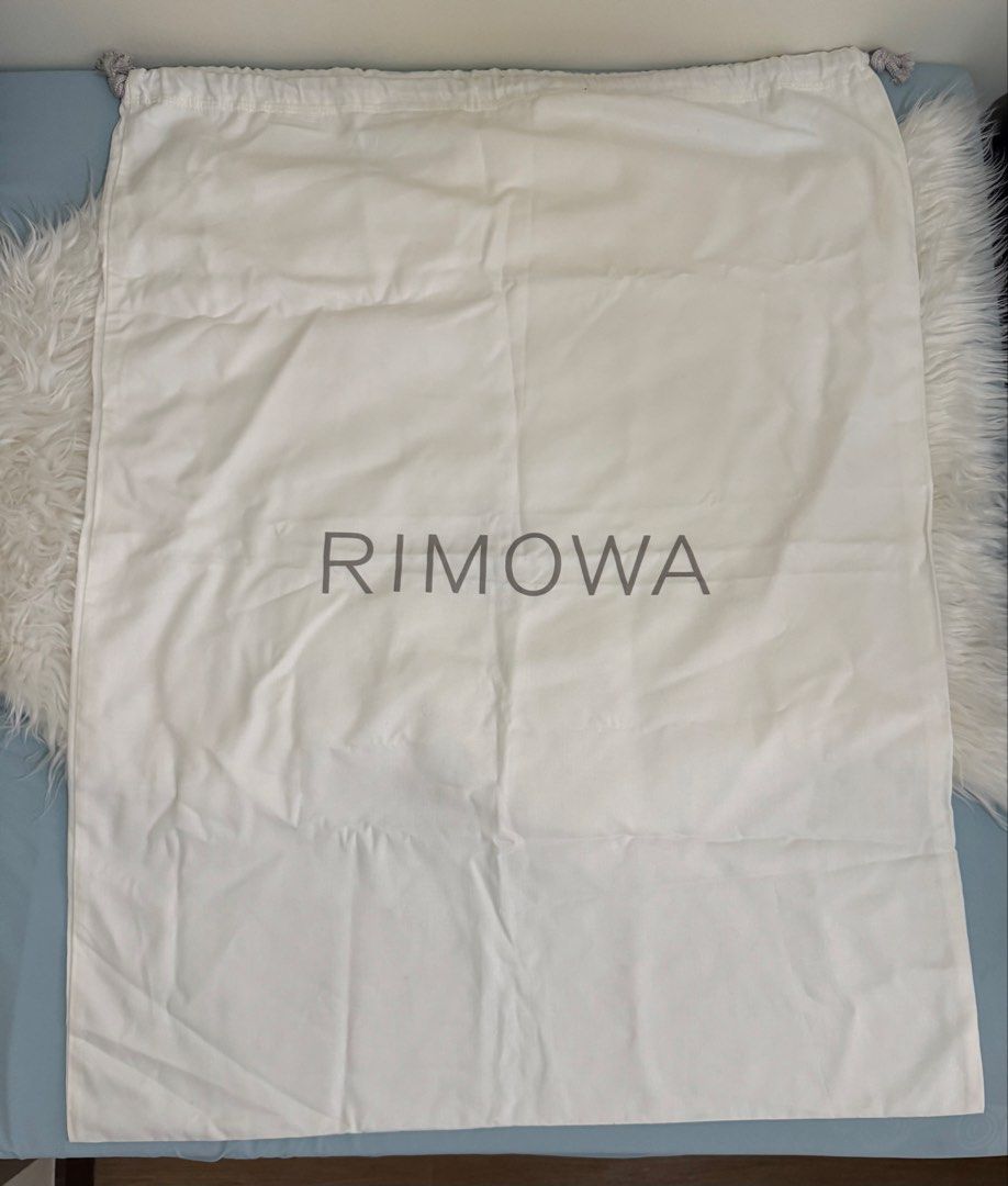Rimowa Dust Bag, Extra Large 34” x 26” (Category: Luxury Bags & Wallets) located in Pasig City. Submitted by topbrandpursuits (Listing ID 1458561988, Image 1). Description: - Features iconic Rimowa logo in front and Moncler logo at the back - Perfect for safeguarding your valuable luggage or bags. - Crafted from soft, protective material. - Secure drawstring closure for easy opening and closing..