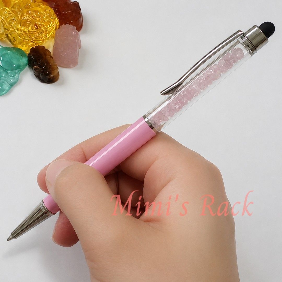 Rose Quartz Crystal Pen with Touch-Screen Stylus (Category: Stationery & School Supplies) located in Taguig. Submitted by mimisrack (Listing ID 1458527555, Image 1). Description: 🩷A beautiful and unique Citrine Crystal Pen -This elegant pen features genuine rose quartz stone chips inside the clear barrel, giving it a lovely natural crystal look while you write. -The pink and silver-tone details add a sophisticated touch, making it perfect for ev