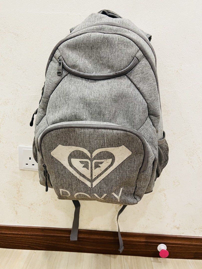 Roxy Grey Backpack (Category: Backpacks) located in Kuala Lumpur. Submitted by 7smile (Listing ID 1458620931, Image 1). Description: - Grey Roxy backpack - Large main compartment - Front pocket - Side mesh pockets - Still has plenty of life left for school or travel A little torn on below part coz it’s leather, overall this bag still good to use Cod : KLCC ,Bukit bintang, Maluri.