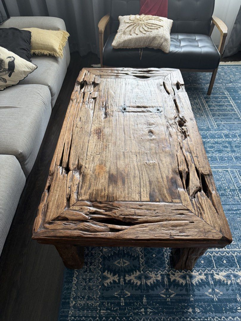 Rustic Solid Wood Coffee Table (Category: Tables & Sets) located in Singapore. Submitted by jassyw (Listing ID 1458574950, Image 3). Description: - Unique, rustic coffee table - Made from solid wood; recycled teak - Distressed, natural finish with rough edges - Textured surface - Sturdy legs for good support - Adds character to any living space - Ideal for bohemian, farmhouse, Balinese -available late September early October .