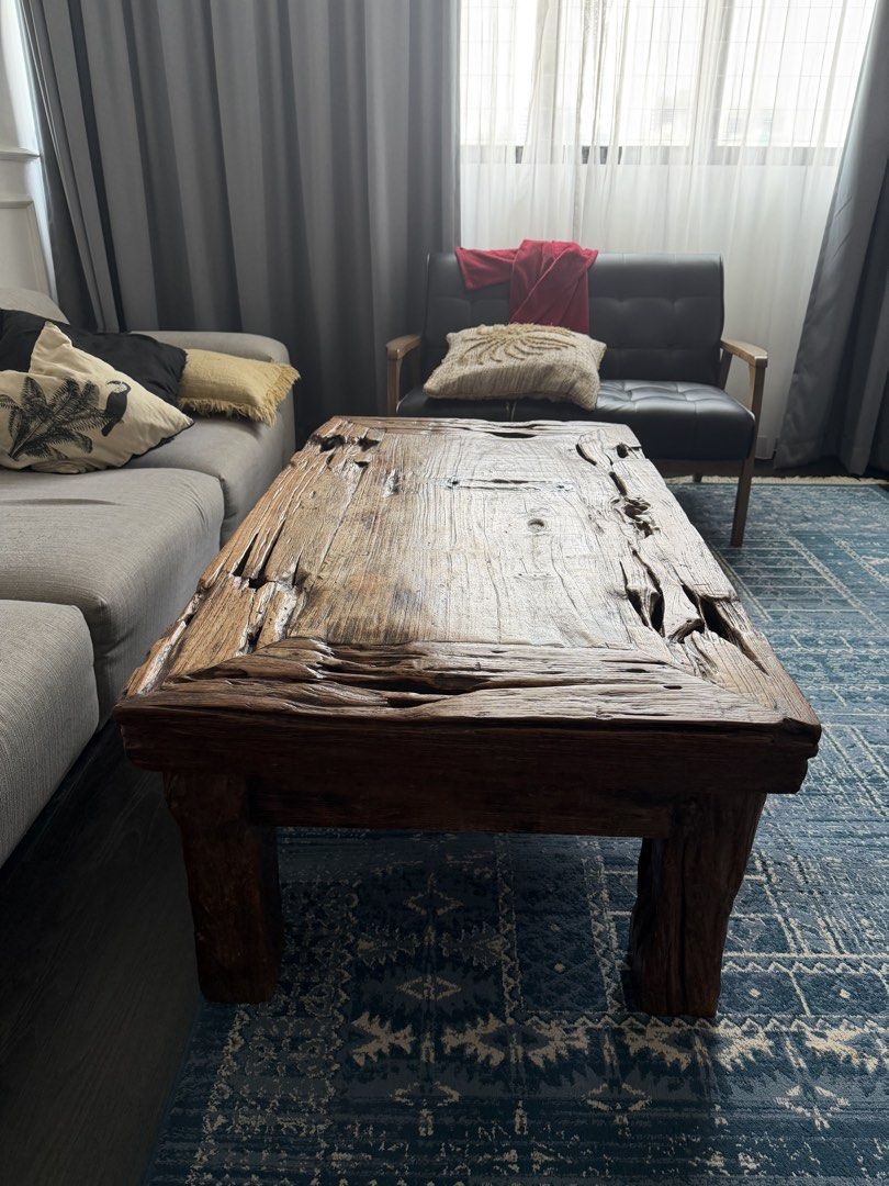 Rustic Solid Wood Coffee Table (Category: Tables & Sets) located in Singapore. Submitted by jassyw (Listing ID 1458574950, Image 2). Description: - Unique, rustic coffee table - Made from solid wood; recycled teak - Distressed, natural finish with rough edges - Textured surface - Sturdy legs for good support - Adds character to any living space - Ideal for bohemian, farmhouse, Balinese -available late September early October .
