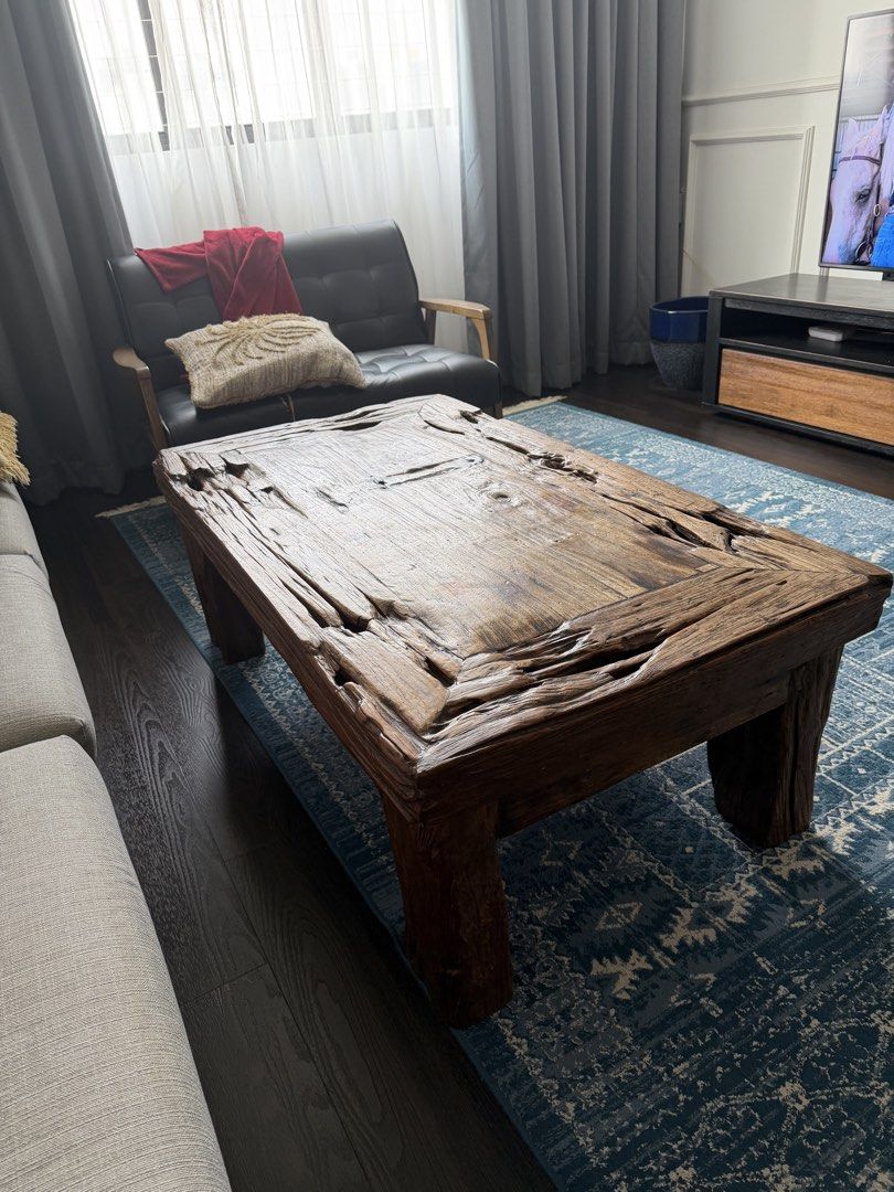 Rustic Solid Wood Coffee Table (Category: Tables & Sets) located in Singapore. Submitted by jassyw (Listing ID 1458574950, Image 1). Description: - Unique, rustic coffee table - Made from solid wood; recycled teak - Distressed, natural finish with rough edges - Textured surface - Sturdy legs for good support - Adds character to any living space - Ideal for bohemian, farmhouse, Balinese -available late September early October .