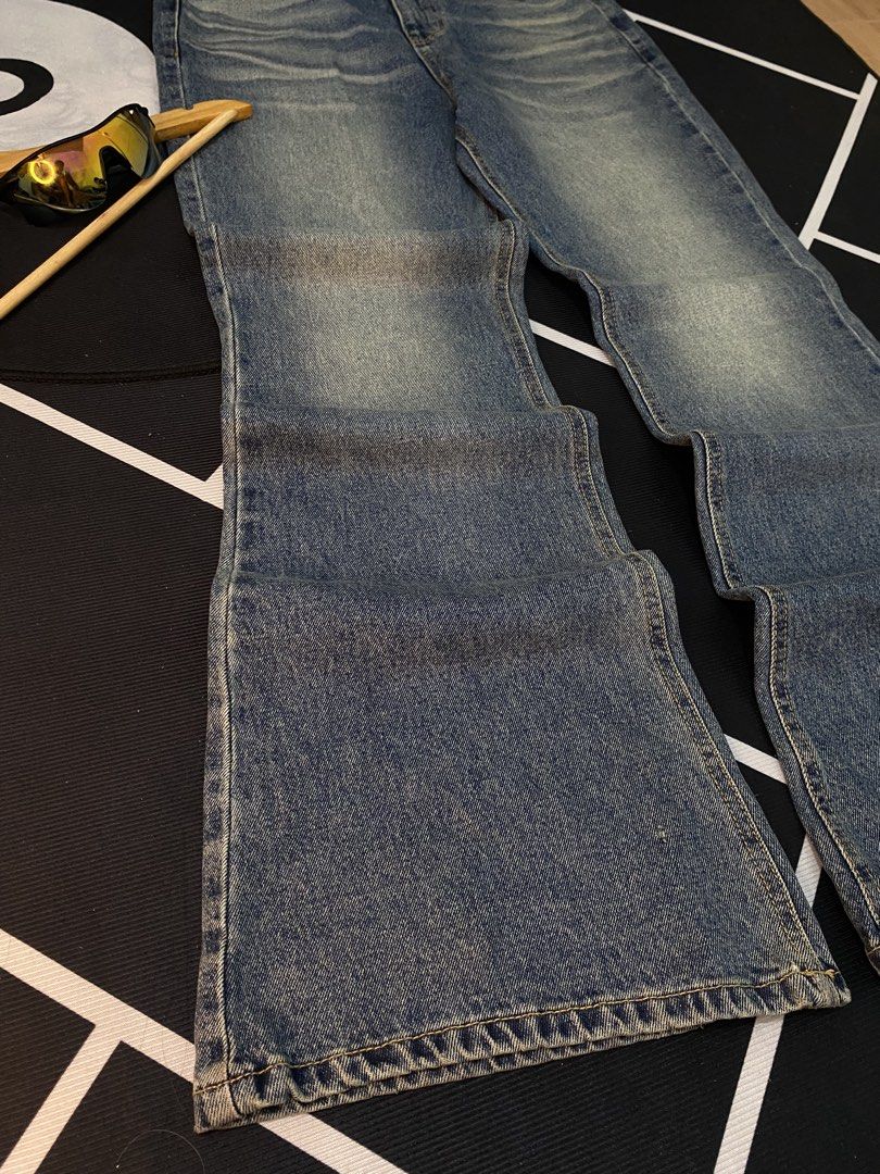 Saint Mort Paris Flared Jeans (Category: Jeans) located in Cateel. Submitted by khan.find_ (Listing ID 1458623317, Image 2). Description: - Saint Mort Paris flared jeans - Classic blue wash with distressed details - High-waisted fit - Wide leg opening for a retro vibe - Button and zip closure - Functional front and back pockets.