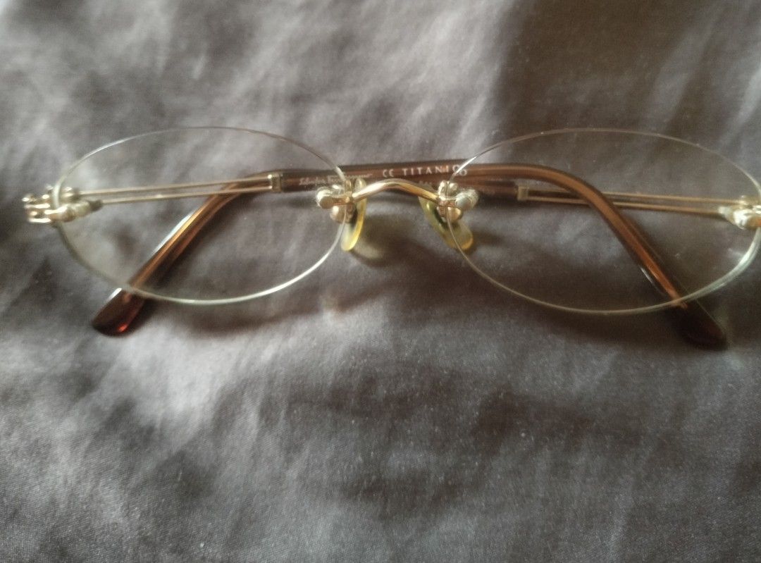 Salvatore Ferragamo Titanium Rimless Eyeglasses (Category: Sunglasses & Eyewear) located in Manila. Submitted by joycedioquino33 (Listing ID 1458537852, Image 1). Description: - Authentic Salvatore Ferragamo - Lightweight and durable titanium - Elegant rimless oval lens design -Japan Surplus sourced.