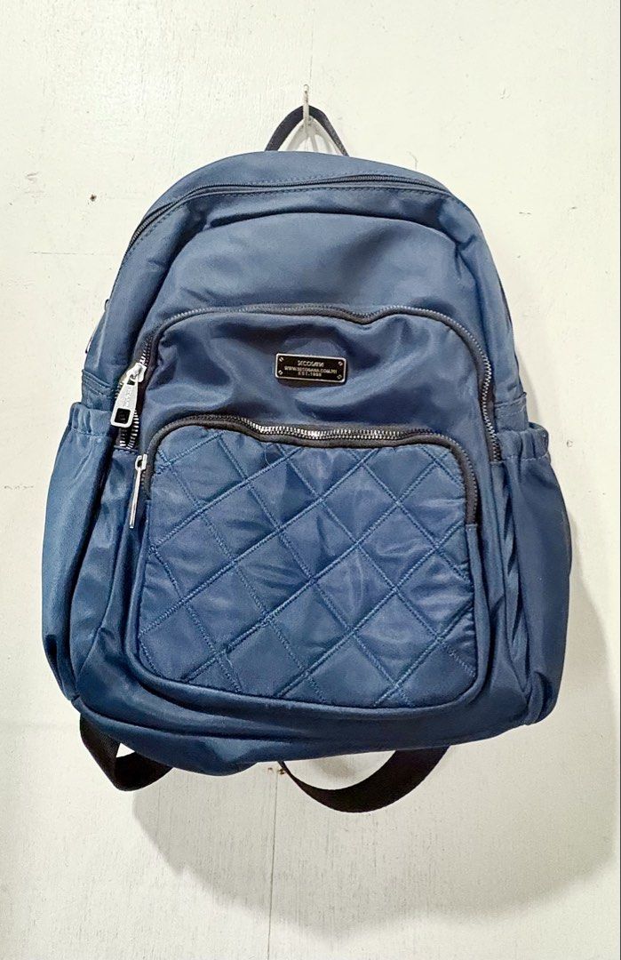 Secosana Navy Blue Quilted Front Nylon Backpack (Category: Backpacks) located in Manila. Submitted by clove127 (Listing ID 1458688886, Image 1). Description: - Price Negotiable! - Size Kasya Tablet/Ipad/ A5 Binder/ Tumbler / Payong - Condi is Like New/ lightly used - Zippers are all working - No stain/tear/scratch - adjustable straps - multiple pockets so oraganized and spacious inside with more zippers and compartment .