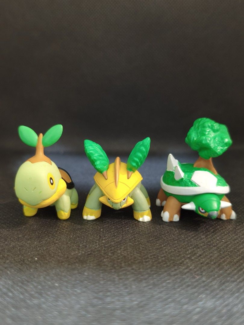 (SET) Turtwig Evolution Line Figures (Yoshinoya) (Category: Figurines & Statues) located in Pasig City. Submitted by poke_knick_knacks (Listing ID 1458683176, Image 1). Description: 📌 PLEASE READ BEFORE BUYING Posted item/s are pre-loved. Minor flaws such as discoloration, dust, scratches, paint chips, loose stitches, or pen markings may be present. Please manage expectations. 🔍 WYSIWYG (What You See Is What You Get) • All photos posted are the