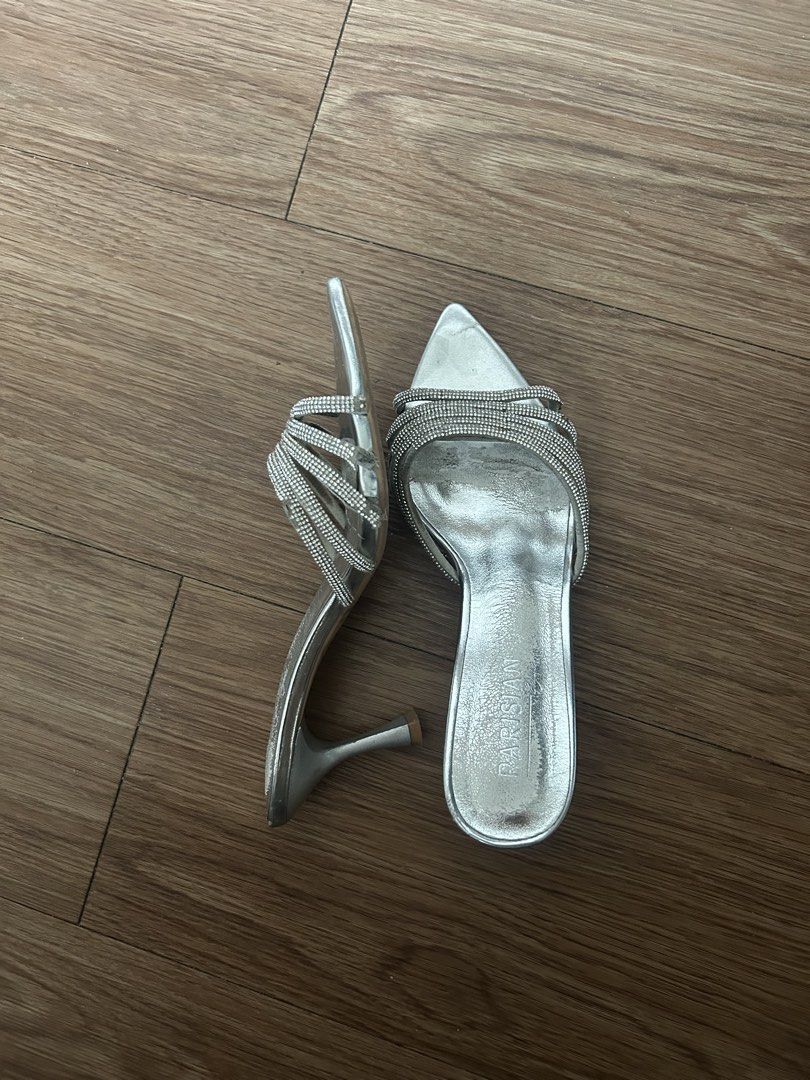 size 6 parisian silver kitten heels (Category: Heels) located in Mandaluyong City. Submitted by moe_naja (Listing ID 1458525525, Image 1). Description: size 6, 23cm, 2 inch heel bought for 1k at SM last March 2026 super cute! rfs: sira na yung gems niya but repairable! selling low meetup/grab/lala/moveit cubao area.