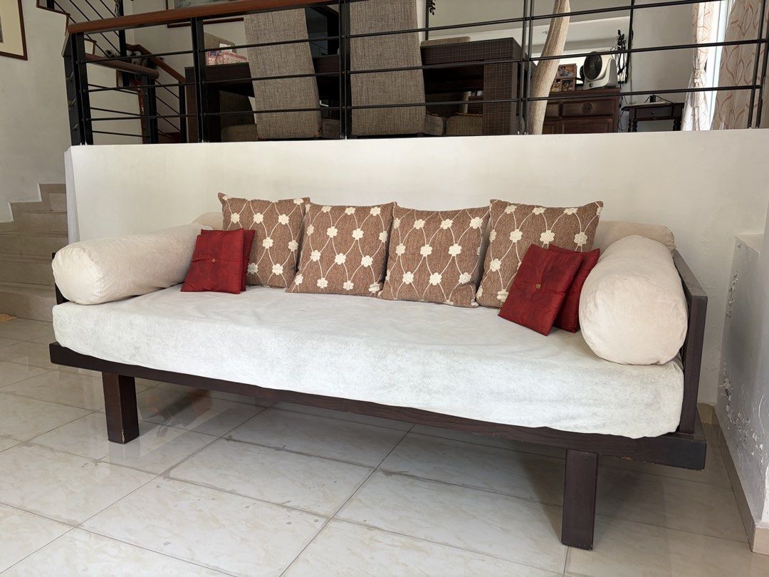 Sofa bed - solid teak (used) (Category: Sofas) located in Singapore. Submitted by kc.undercover (Listing ID 1458622949, Image 2). Description: Sofa bed - solid teak (used) * about 2.3m wide * well used, shows signs of wear * sold without the square and red pillows shown in the pictures Terms of sale: * Slightly negotiable. * Sold ‘as is’. * No prior viewing. * No trades, no refunds, no exchange. * Self-collect. * Seller will not be responsible fo