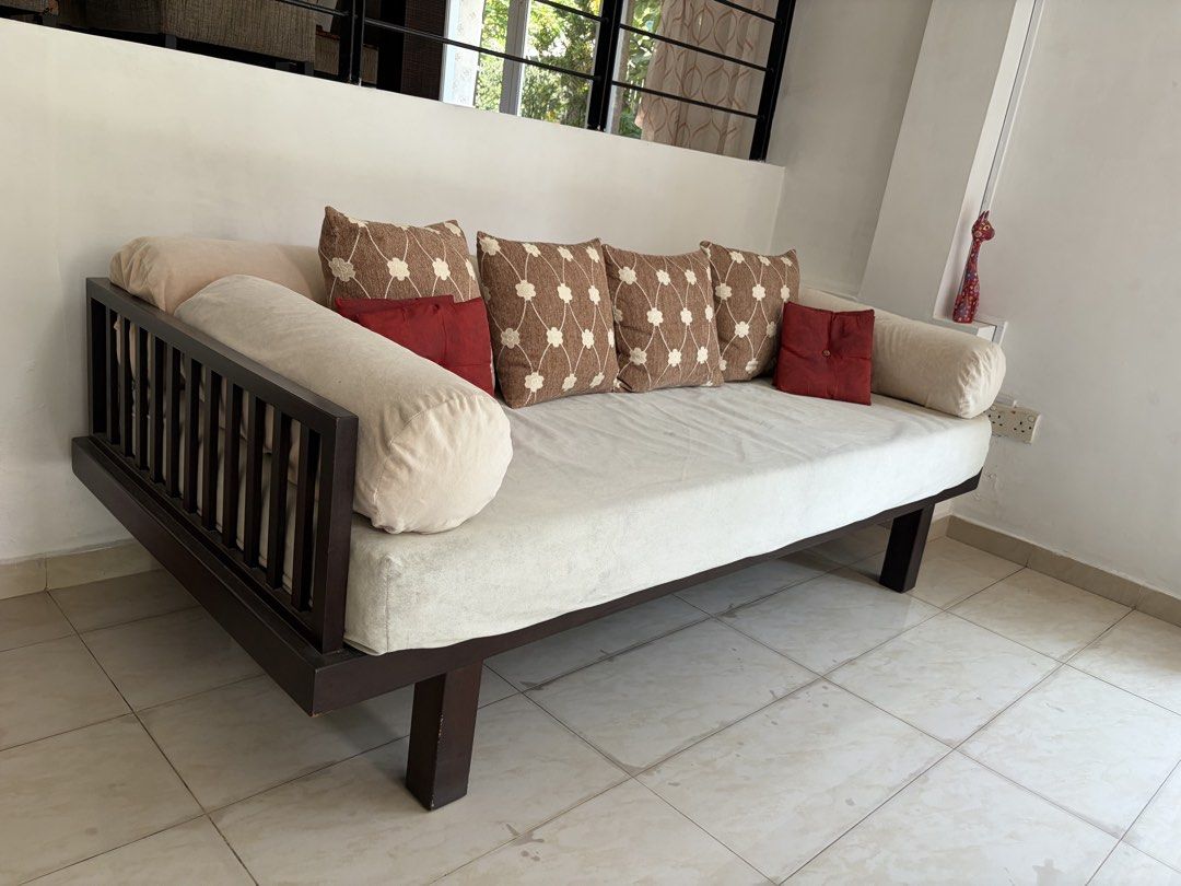 Sofa bed - solid teak (used) (Category: Sofas) located in Singapore. Submitted by kc.undercover (Listing ID 1458622949, Image 1). Description: Sofa bed - solid teak (used) * about 2.3m wide * well used, shows signs of wear * sold without the square and red pillows shown in the pictures Terms of sale: * Slightly negotiable. * Sold ‘as is’. * No prior viewing. * No trades, no refunds, no exchange. * Self-collect. * Seller will not be responsible fo