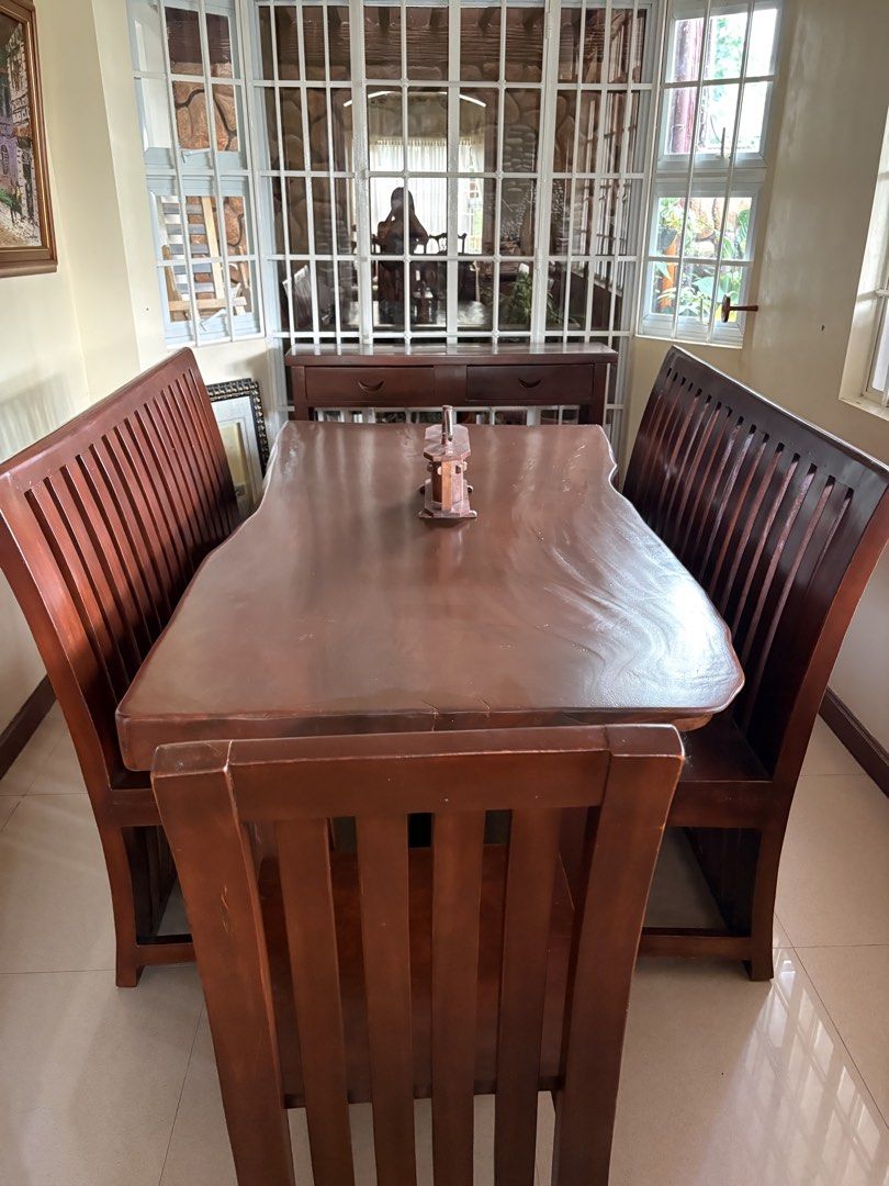 Solid Acacia wood dining table set (8 seater) (Category: Tables & Sets) located in Batangas. Submitted by cinnacoll (Listing ID 1458563401, Image 2). Description: - Solid wood dining set with 2 long benches and 2 chairs - Newly varnished and restored, good as new! - Seats are actually very comfortable despite being solid acacia - Can fit 2-4 people in each bench - Great for family meals and if you like hosting guests - Decorative item on too isn’