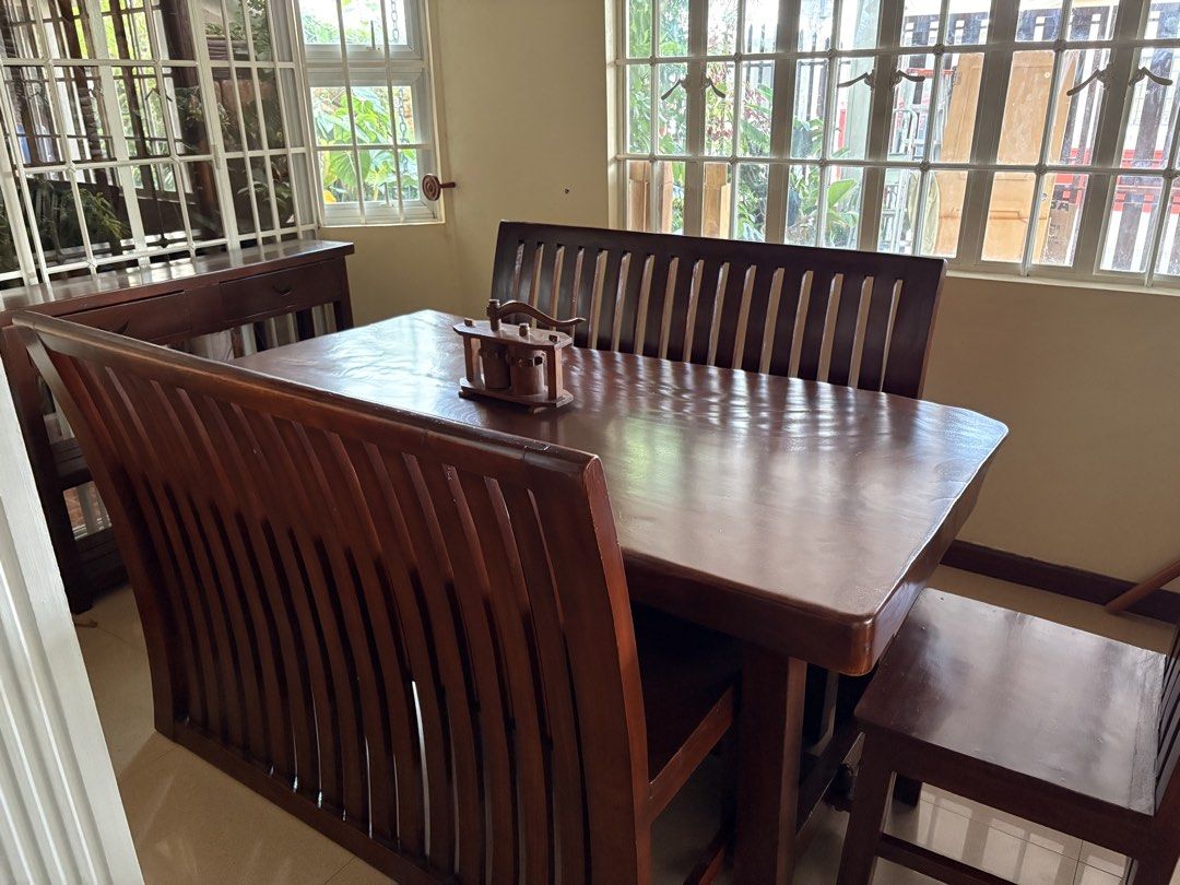 Solid Acacia wood dining table set (8 seater) (Category: Tables & Sets) located in Batangas. Submitted by cinnacoll (Listing ID 1458563401, Image 3). Description: - Solid wood dining set with 2 long benches and 2 chairs - Newly varnished and restored, good as new! - Seats are actually very comfortable despite being solid acacia - Can fit 2-4 people in each bench - Great for family meals and if you like hosting guests - Decorative item on too isn’