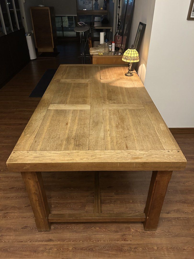 Solid Wood Dining Table (Category: Tables & Sets) located in Singapore. Submitted by ys20w (Listing ID 1458636773, Image 3). Description: Selling very sturdy, solid wood dining table with a classic paneled top. Seats 6-8 people comfortably. Great for family meals or entertaining guests. Has a nice wood grain surface, but some warping on the surface which adds character. Legs are sturdy and robust, and can be dismantled from table surface for movi