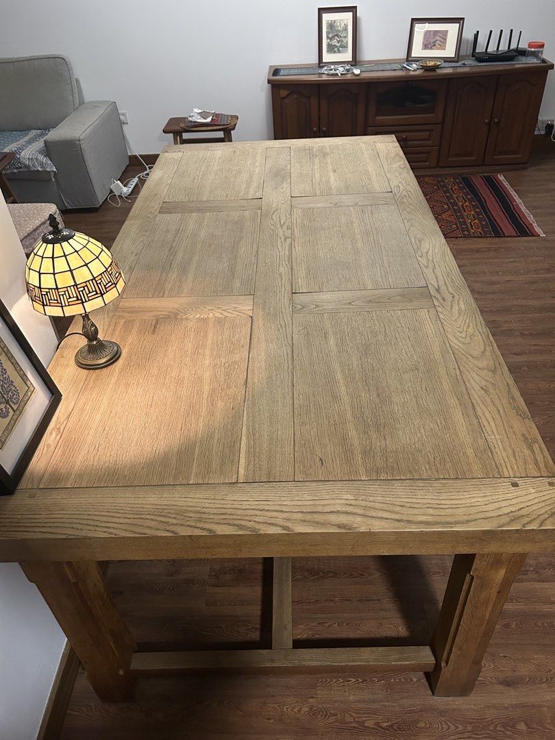 Solid Wood Dining Table (Category: Tables & Sets) located in Singapore. Submitted by ys20w (Listing ID 1458636773, Image 1). Description: Selling very sturdy, solid wood dining table with a classic paneled top. Seats 6-8 people comfortably. Great for family meals or entertaining guests. Has a nice wood grain surface, but some warping on the surface which adds character. Legs are sturdy and robust, and can be dismantled from table surface for movi