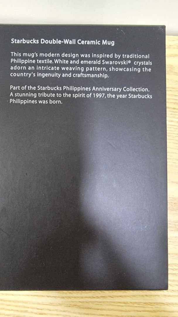 Starbucks Philippines 20th Anniversary Double-Wall Ceramic Mug (Category: Coffee & Tea Tableware) located in Paranaque City. Submitted by olxph_668280920 (Listing ID 1458573125, Image 3). Description: - Starbucks Philippines 20th Anniversary Double-Wall Ceramic Mug - Modern design inspired by traditional Philippine textile - Adorned with white and emerald Swarovski crystals in an intricate weaving pattern - A tribute to the spirit of 1997, the ye