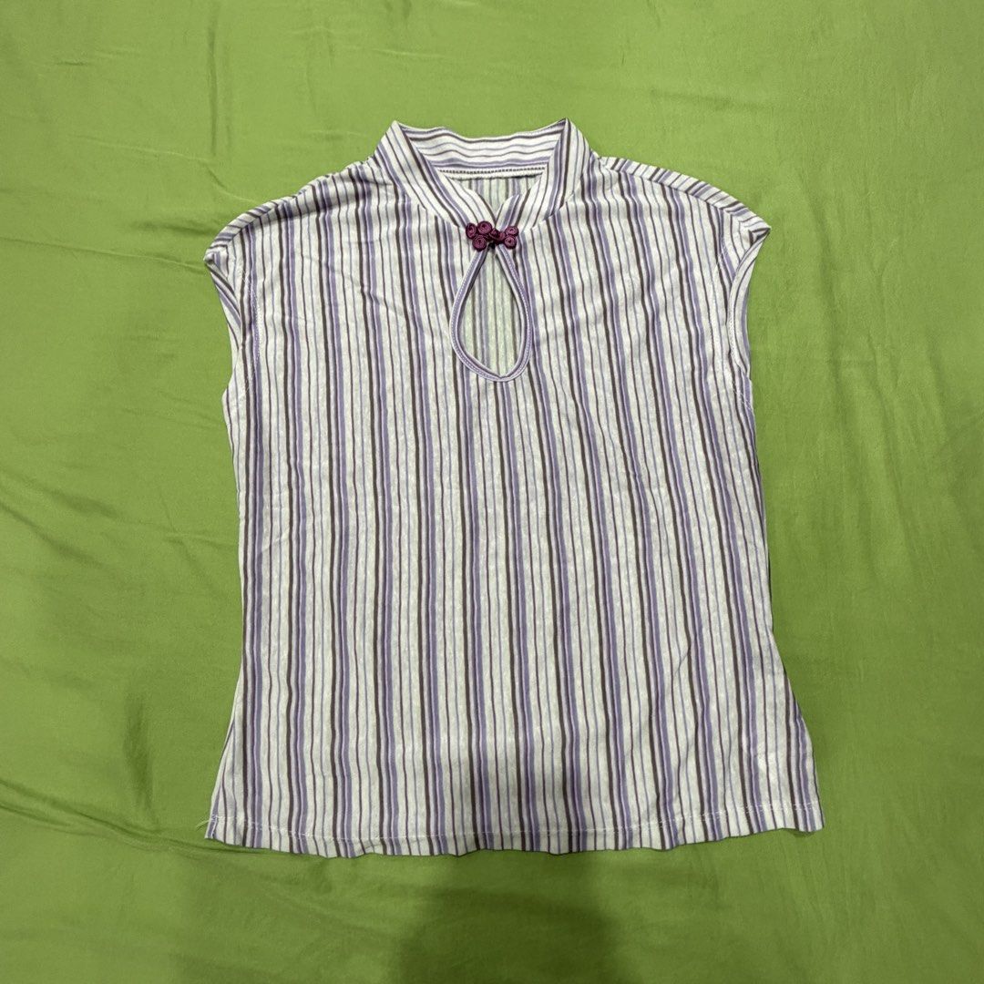 Striped Mandarin Collar Top with Button Detail (Category: Blouses) located in Manila. Submitted by tidyspace.ph (Listing ID 1458540378, Image 1). Description: - Sleeveless top - Mandarin collar with keyhole cutout and decorative button - Vertical stripe pattern in white, purple, and dark grey - Fabric with slight stretch - Ideal for casual wear.