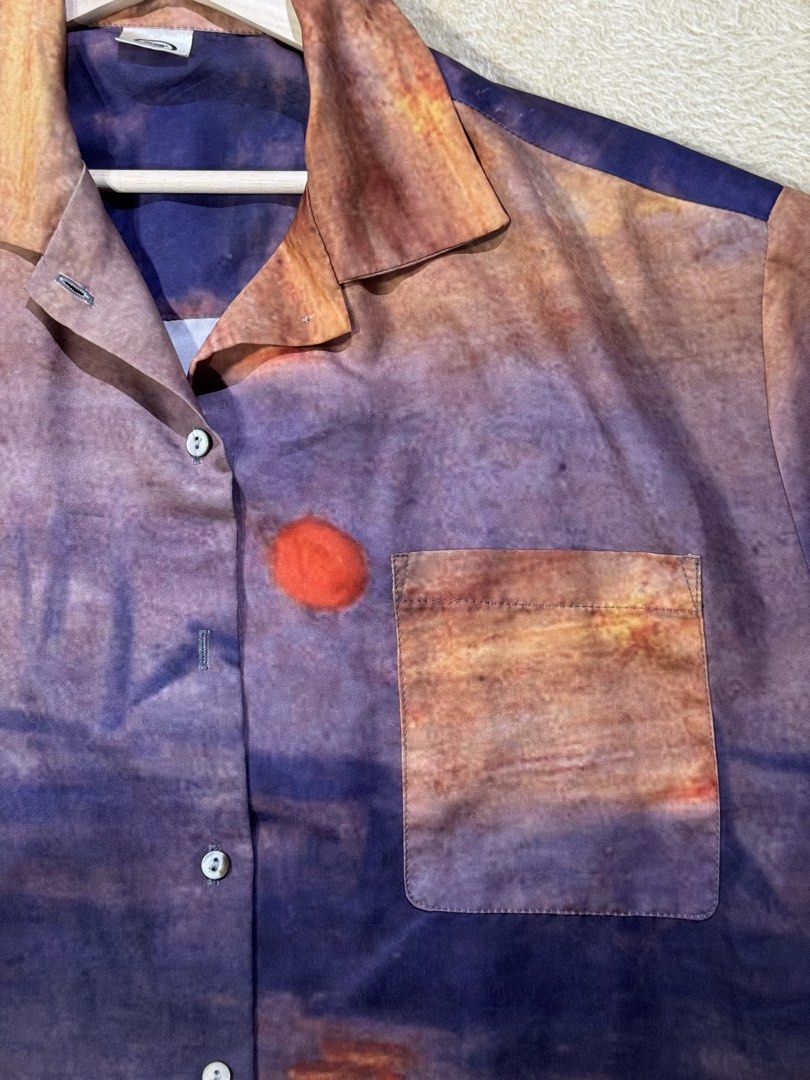 Sunset Print Button-Up Shirt (Category: Tshirts & Polo Shirts ) located in Caloocan City. Submitted by poch.queue (Listing ID 1458547290, Image 2). Description: - Oversize button-up shirt with sunset design - Convenient chest pocket - Missing one button - Fits Medium for Men.