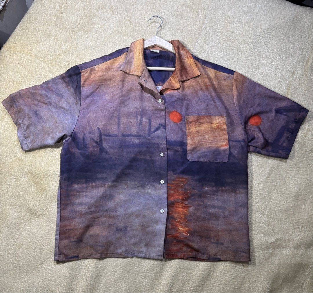 Sunset Print Button-Up Shirt (Category: Tshirts & Polo Shirts ) located in Caloocan City. Submitted by poch.queue (Listing ID 1458547290, Image 1). Description: - Oversize button-up shirt with sunset design - Convenient chest pocket - Missing one button - Fits Medium for Men.