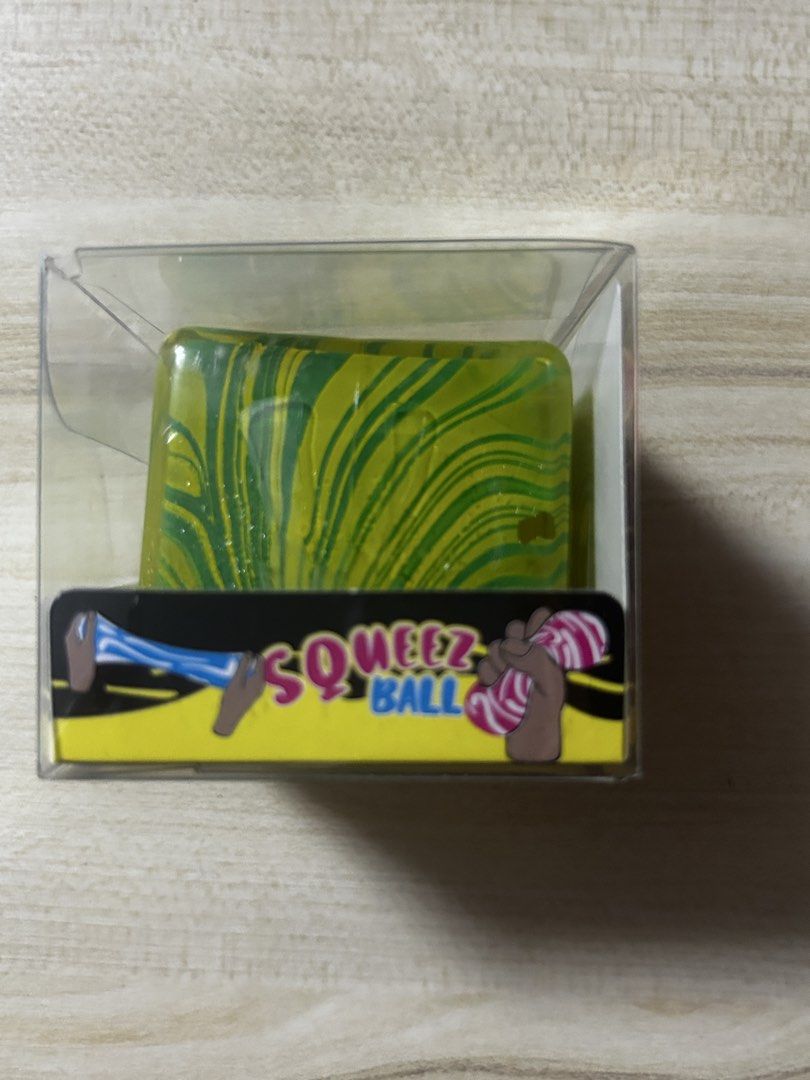 SUPER RARE: Squeezz Cube Toy - Original from US (Category: Kids Toys) located in Pateros City. Submitted by thesisties (Listing ID 1458586738, Image 2). Description: -Fun Squeezz Cube - Super stretchy and squishy texture - Ideal for fidgeting and play - Comes in a clear display box - Perfect for kids and adults seeking stress relief.
