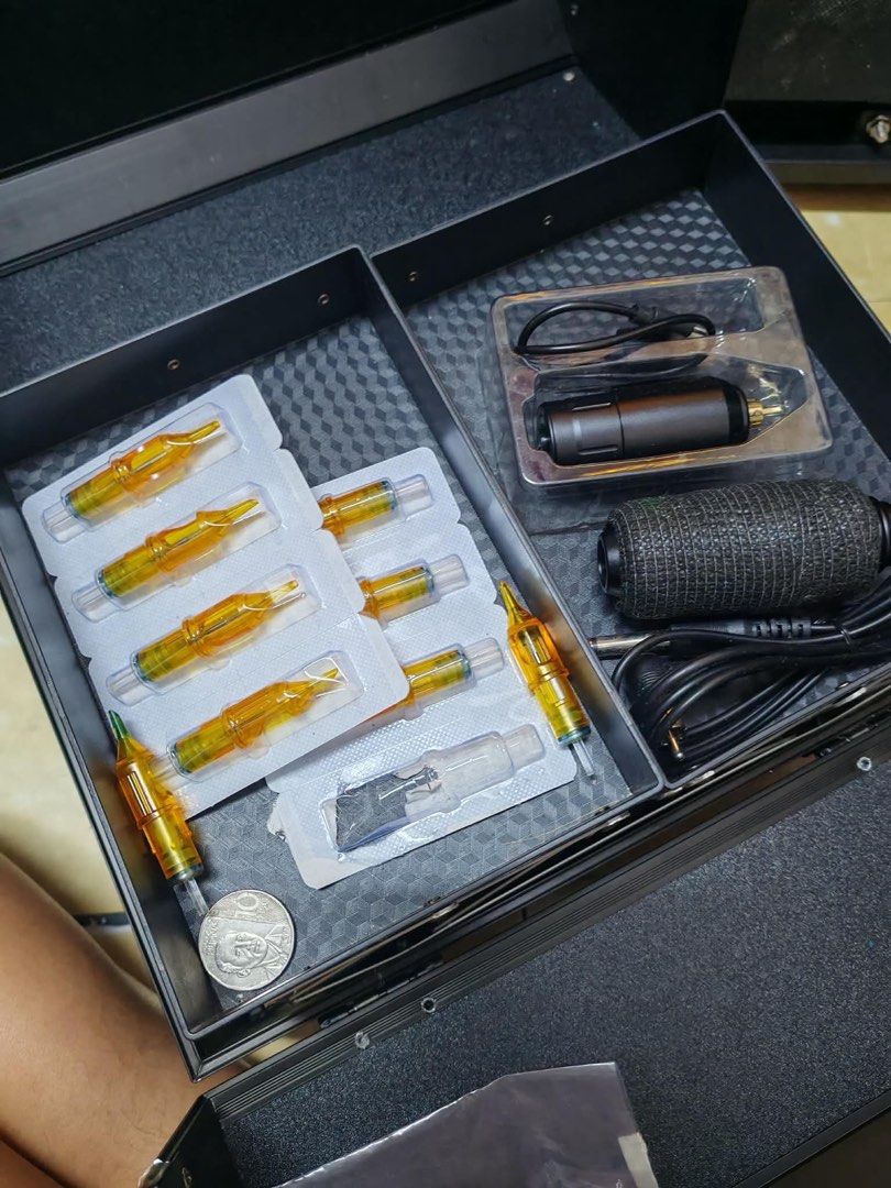Tattoo Equipment with Tattoo Attache case (Category: Craft Supplies & Tools) located in Manila. Submitted by mhaicav (Listing ID 1458556179, Image 2). Description: Inclusion: Tattoo machine set pen type rechargeable Tattoo organizer case Ink measuring cup Needle 1rl Fake skin Tattoo gel (stencil) Tattoo soap cleaning foam gonna send more pictures if interested.