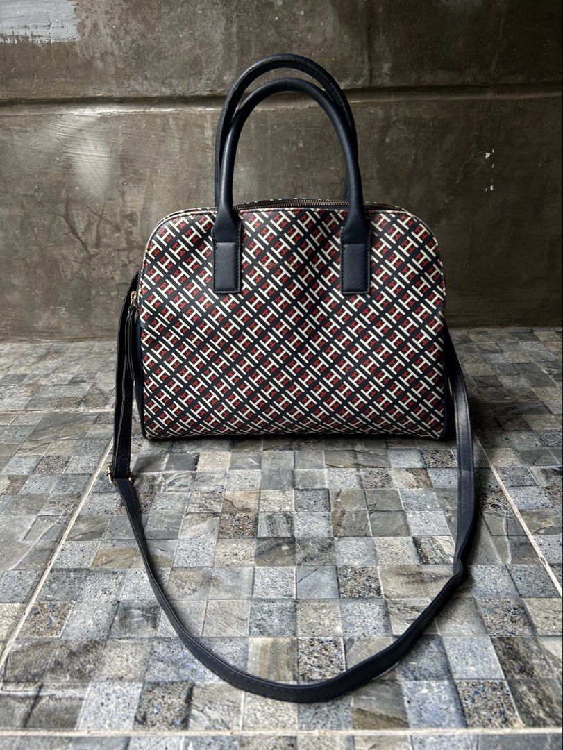 Tommy Hilfiger Monogram Dome Satchel Bag (Category: Cross-body Bags) located in Quezon City. Submitted by commonwealthpickerph (Listing ID 1458529090, Image 1). Description: Tommy Hilfiger Monogram Dome Satchel Bag - The typical dimensions for this specific medium-to-large dome satchel model are: - Length / Width: 11.5 to 13 inches (approx. 29 to 32 cm) - Height: 8.5 to 9.5 inches (approx. 21 to 24 cm) - Depth / Thickness: 5 inches (approx. 13 cm