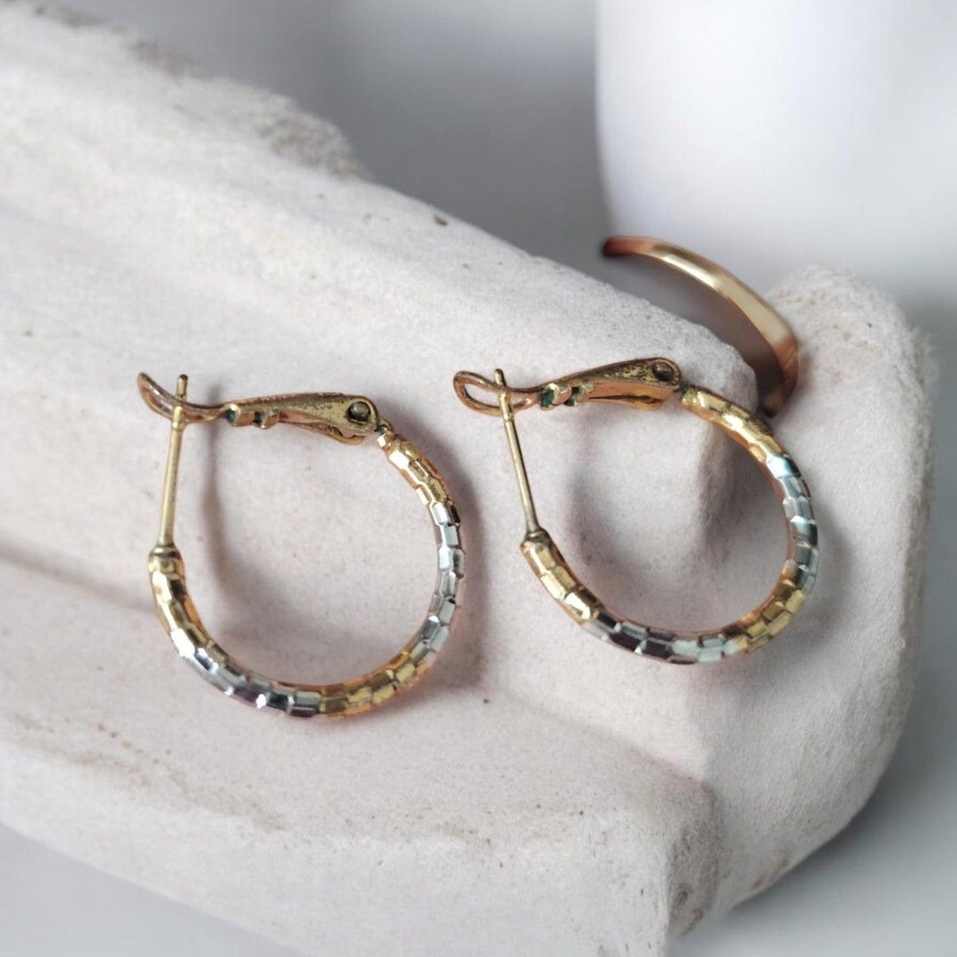Tri-tone Hoop Earrings (Category: Earrings) located in Antipolo. Submitted by goodsinger (Listing ID 1458528114, Image 1). Description: - Mix of gold and silver tones - Textured, segmented design - Classic hoop shape - Secure clasp - Adds shine to any outfit - Versatile for everyday or special occasions.