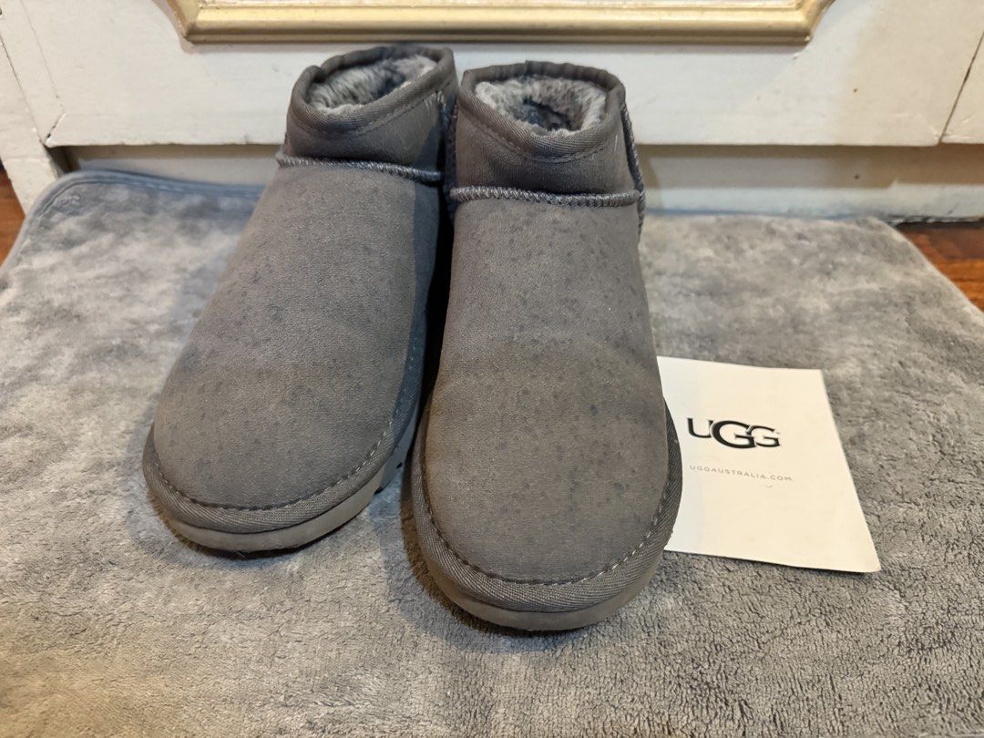 UGG Classic Mini II Grey Suede Boots (Category: Boots) located in Manila. Submitted by hakunashop (Listing ID 1458562387, Image 2). Description: - Grey UGG Classic Mini boots - Made with genuine suede and soft sheepskin lining - Provides warmth and comfort for cooler weather - Comes with original tag - Ideal for everyday casual wear - Bigger is better for thicker socks - Bought online, authenticity not guaranteed - Size US 10 or 27cm.