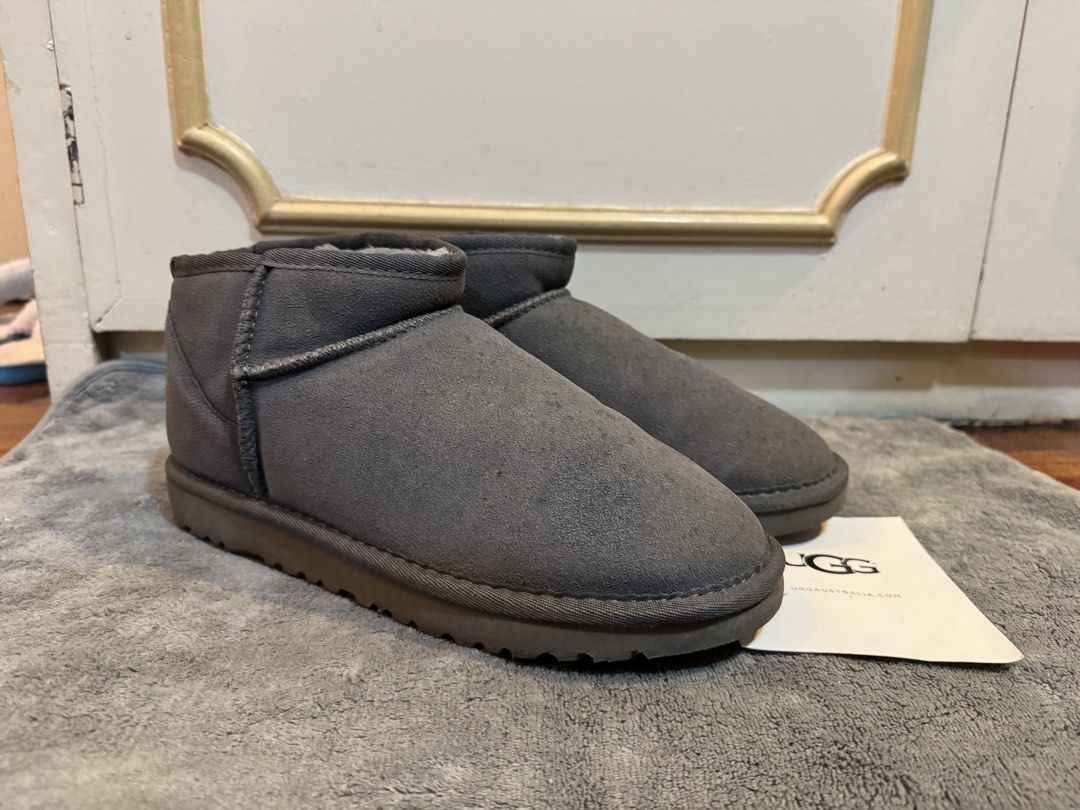 UGG Classic Mini II Grey Suede Boots (Category: Boots) located in Manila. Submitted by hakunashop (Listing ID 1458562387, Image 3). Description: - Grey UGG Classic Mini boots - Made with genuine suede and soft sheepskin lining - Provides warmth and comfort for cooler weather - Comes with original tag - Ideal for everyday casual wear - Bigger is better for thicker socks - Bought online, authenticity not guaranteed - Size US 10 or 27cm.