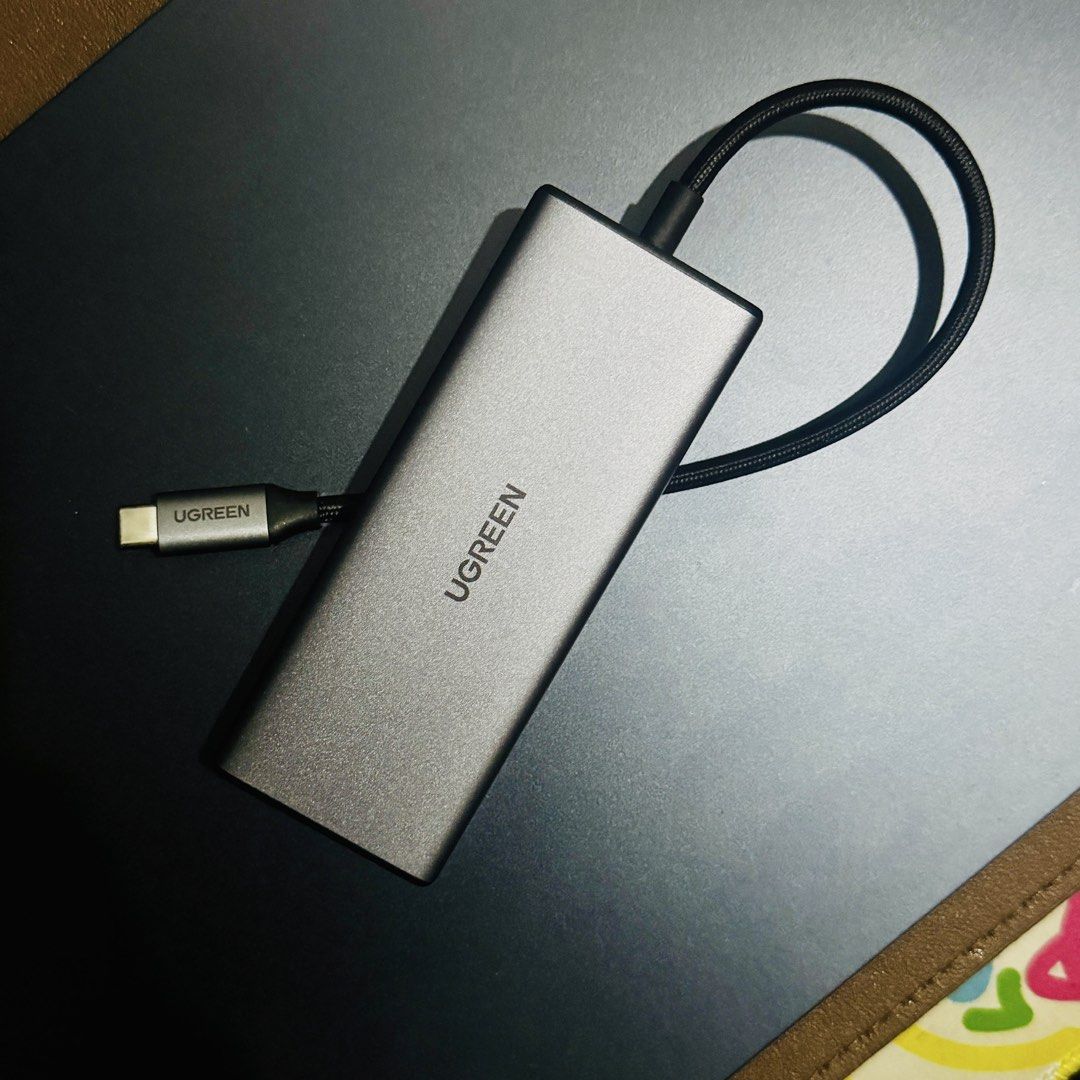UGREEN 7-in-1 USB-C Hub Adapter Macbook Hub Dock (Category: Cables & Adaptors) located in Caloocan City. Submitted by all-reet (Listing ID 1458522192, Image 1). Description: Just bought it last Aug 20 (for P2,000). Only used for testing then realized I needed more ports. Selling now for P1,500 - UGREEN 7-in-1 USB-C Hub: Massive device expansion. - Power Delivery: PD 100W for fast charging. - Display: HDMI output supports 4K@30Hz. - Card Readers: 
