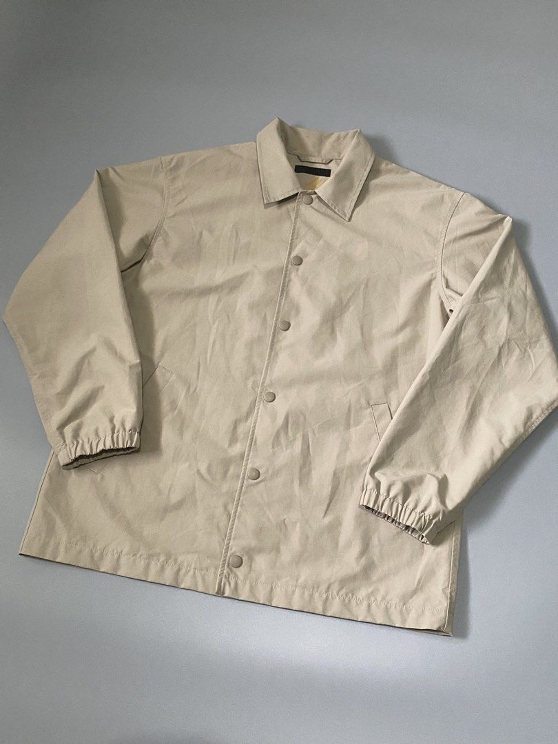 Uniqlo Beige Coach Jacket Size M (Category: Coats, Jackets and Outerwear) located in Mandaue City. Submitted by dfindss. (Listing ID 1458535793, Image 2). Description: - Uniqlo Coach Jacket - Color: Beige - Size: Medium (M) - Material: Shell (65% Polyester, 35% Cotton), Lining (100% Polyester) - Features: Button-up front, elasticated cuffs, two side pockets - Additional: Mesh lining inside, pocket lining made with recycled materials - Origin: Mad