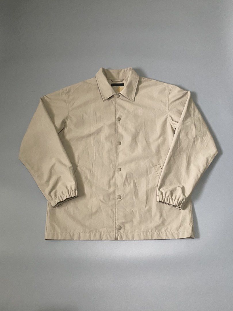 Uniqlo Beige Coach Jacket Size M (Category: Coats, Jackets and Outerwear) located in Mandaue City. Submitted by dfindss. (Listing ID 1458535793, Image 1). Description: - Uniqlo Coach Jacket - Color: Beige - Size: Medium (M) - Material: Shell (65% Polyester, 35% Cotton), Lining (100% Polyester) - Features: Button-up front, elasticated cuffs, two side pockets - Additional: Mesh lining inside, pocket lining made with recycled materials - Origin: Mad