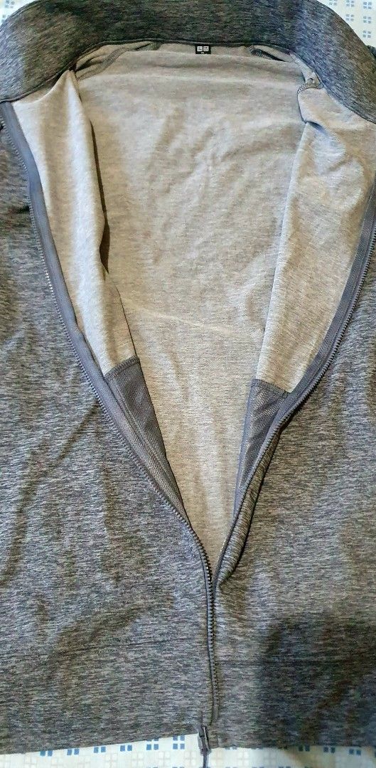 Uniqlo Grey Heathered Full Zip Jacket XL (Category: Coats, Jackets and Outerwear) located in Cainta. Submitted by origeetostore (Listing ID 1458685617, Image 3). Description: - Uniqlo Grey Heathered Full Zip Jacket - Size: XL - Color: Grey Heathered - Features: Stand-up collar, zippered pockets - Material: Comfortable and lightweight - Ideal for: Workouts or casual wear - Origin: Made in Vietnam UNIQLO Track Jacket Color: Gray Size: XL Used but g