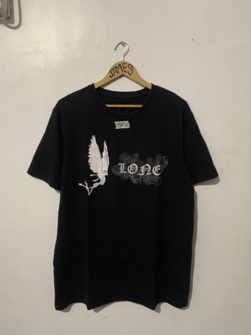 VLONE (Category: Tshirts & Polo Shirts ) located in Manila. Submitted by tanjames.14 (Listing ID 1458603766, Image 1). Description: - Black VLONE T-Shirt - Size: XL - Front Design: White eagle graphic with 'VLONE' text in smoke detail - Back Design: Large 'V' graphic with smoke detail - Material: 100% Cotton.