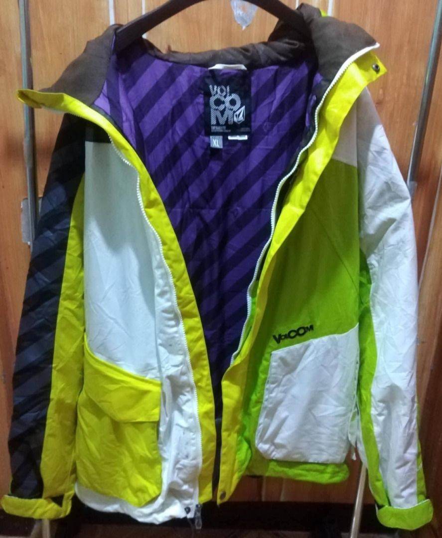 Volcom Snowboard Jacket XL (Category: Coats, Jackets and Outerwear) located in Baguio. Submitted by jonandaya (Listing ID 1458685104, Image 2). Description: - Volcom Snowboard Jacket - Size: XL - Design: Bold color block with green, white, and black stripes - Interior Lining: Vibrant purple with diagonal stripes - Closure: Zipper with branded pull tab - Perfect for: Snowboarding or stylish winter wear.