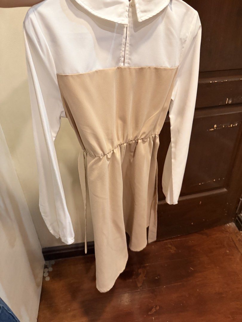 White and Beige Collared Long Sleeve Dress (Category: Dresses) located in Manila. Submitted by tabsy (Listing ID 1458658206, Image 1). Description: - White long sleeve top - Beige overlay with Peter Pan collar - Elasticated waist with tie belt - Button details on overlay - Versatile for smart casual, work, or day out.