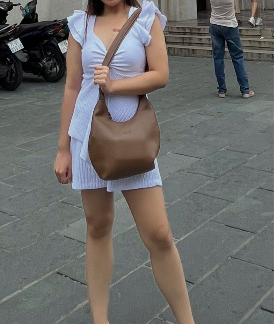 White Coordinates - top and shorts (Category: Sets or Coordinates) located in Quezon City. Submitted by lune17 (Listing ID 1458543387, Image 1). Description: hi! only worn once abroad. can fit to semi-large .