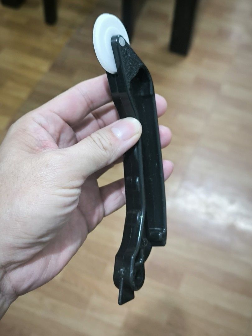 Window screen Roller Tool with Wheel (Category: Construction Tools & Equipment) located in Angeles City. Submitted by yellowbrickstore (Listing ID 1458688673, Image 3). Description: - Black roller tool with a white wheel - Textured plastic handle - Useful for various tasks - Shows some signs of use but is still functional - Please check photos for detailed condition.