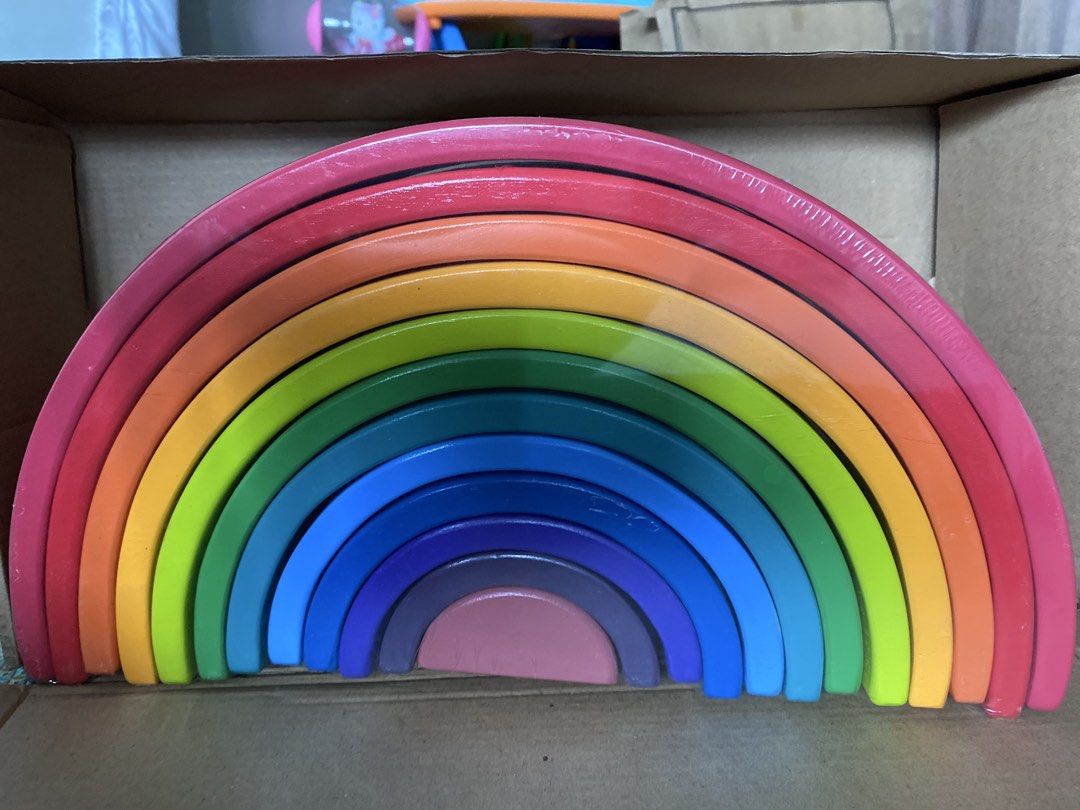 Wooden Rainbow Stacker Toy (Category: Educational & Learning Toys) located in Quezon City. Submitted by dyc2015 (Listing ID 1458577319, Image 2). Description: - Wooden rainbow stacking toy - Features multiple colorful arches - Ideal for open-ended play, stacking, and nesting - Doubles as a charming decorative piece - Helps develop fine motor skills and creativity - Provides hours of fun for children.