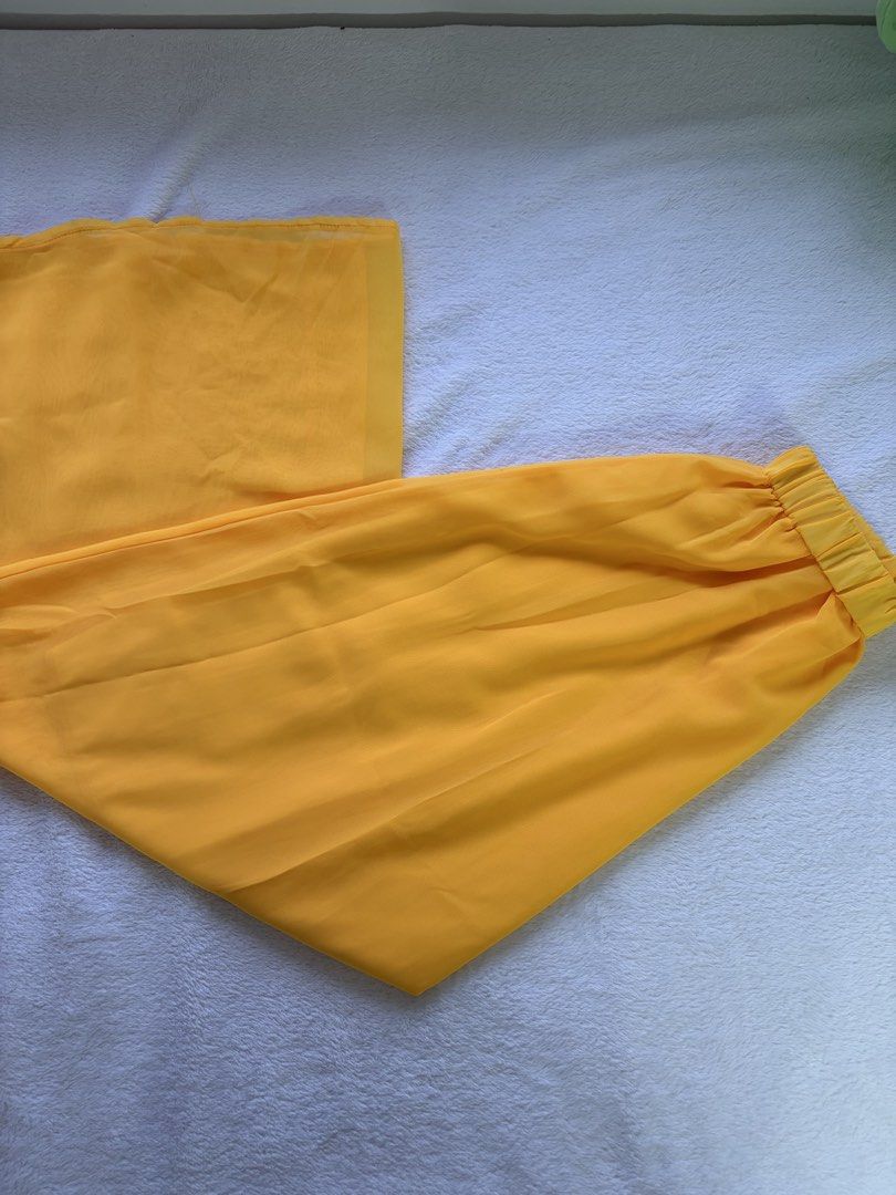 Yellow Chiffon Ruched Top & Wide Leg Pants Set (Category: Sets or Coordinates) located in Antipolo. Submitted by trinannounce (Listing ID 1458599148, Image 2). Description: - Bright yellow chiffon set - Sleeveless top with ruched front and high neckline - Matching wide-leg pants with elastic waistband - Lightweight and flowy material - Great for a pop of color - Worn once for an event.